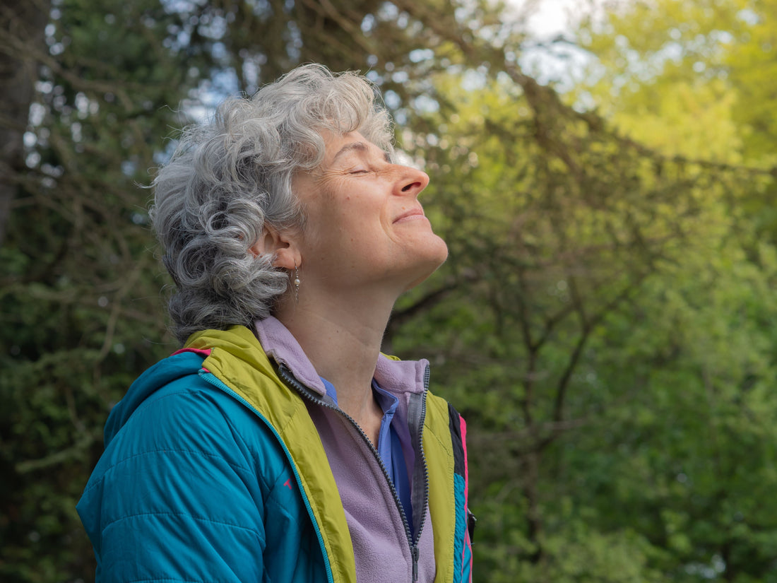 An older woman breathing happily